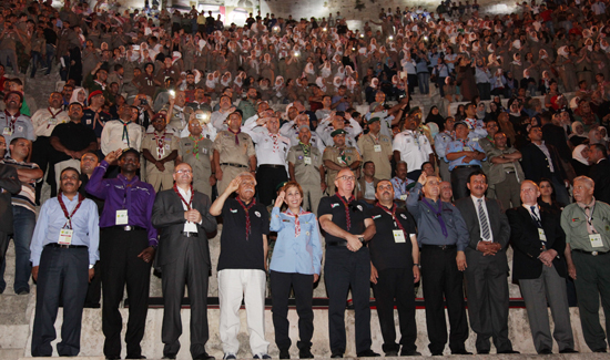 HRH Princess Basma makes the scout salute at an event to celebrate the 31st Arab Scouts Camp at the Roman Theatre in downtown Amman on Sunday (Petra photo)